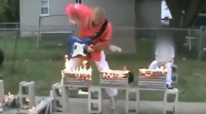 Man Chops Fiery Blocks Into Pieces While Shredding Guitar, You Won’t Believe This