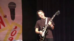 Kid Slays It At Talent Show With “We Will Rock You”