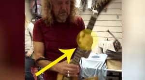 Fan Hands Robert Plant A Guitar- People IMMEDIATELY Start Filming