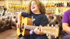 10-Year Old Guitar Prodigy Walks Into A Guitar Shop & Plays Beautiful, Acoustic Tribute To Tom Petty!