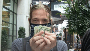 Taylor Hawkins Trades His Autographs For Money – Watch