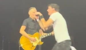 Fan Rushes Stage While Bryan Adams Performs “Summer of ’69”