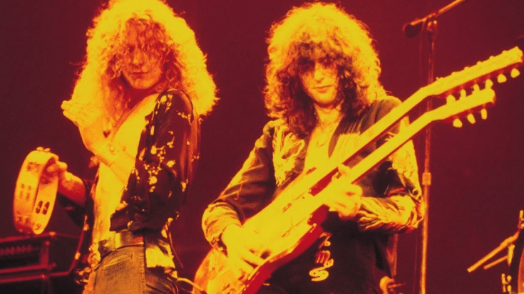 Robert Plant and Jimmy page perfoming under a very yellow light.