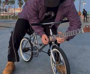 Watch This Innovator Play a Guitar Bike – A Bicycle with a Guitar Neck!