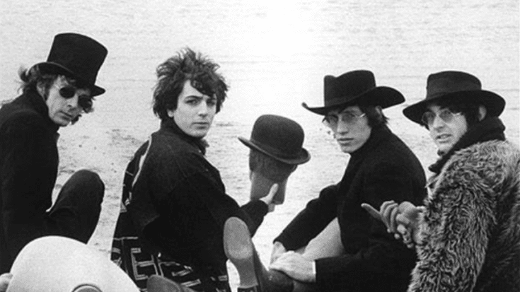 Early Pink Floyd lineup with Syd Barrett wearing hats on a beach in 1967