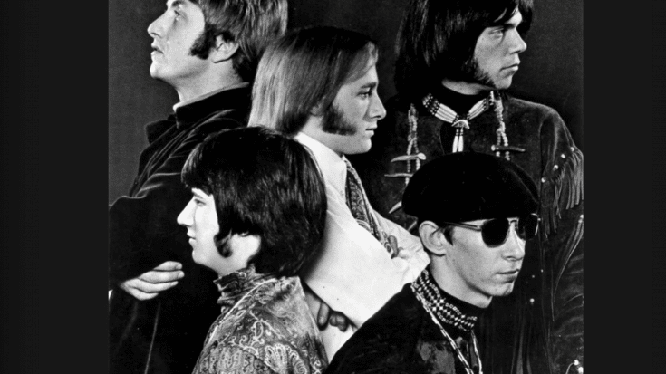 A black and white promotional photo of the 1960s rock band Buffalo Springfield, featuring five members in a stylized profile pose.