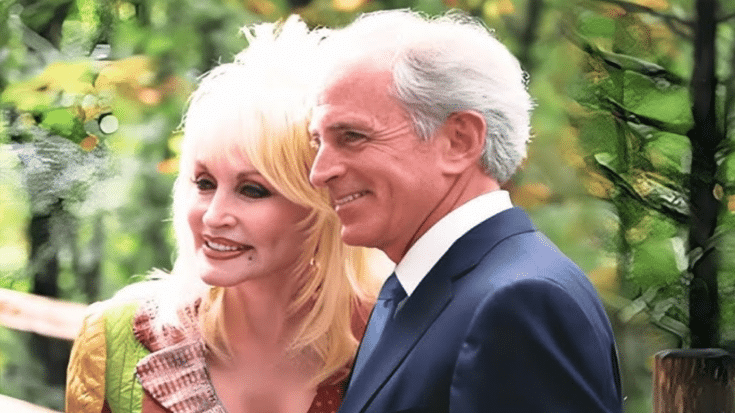 Dolly Parton and her husband, Carl Dean, smiling together outdoors.