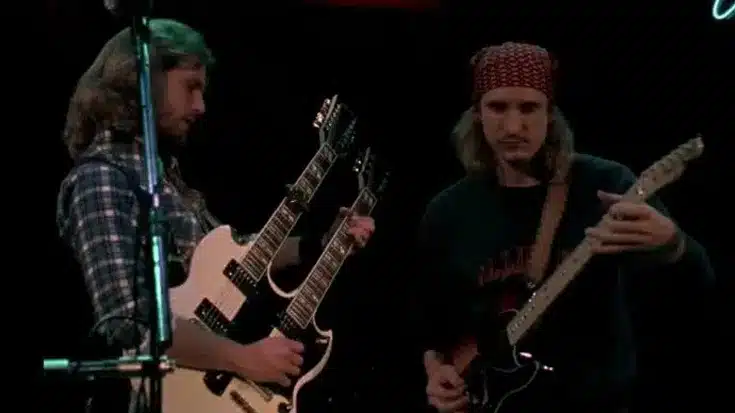 Don Felder and Joe Walsh performing live onstage, showcasing the dual-guitar energy that helped define the Eagles’ late-'70s sound.