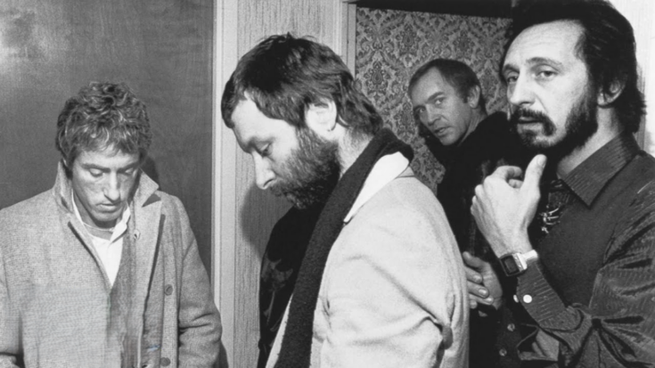 The Who members stand solemnly backstage following the 1979 Cincinnati concert tragedy where 11 fans were killed in a stampede.