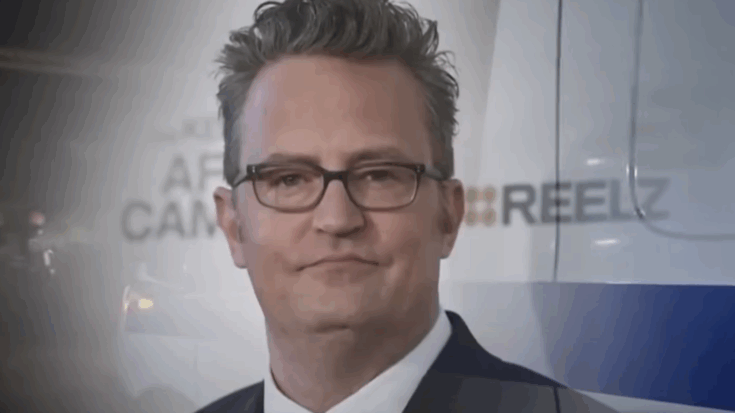 matthew perry wearing sunglasses and a suit