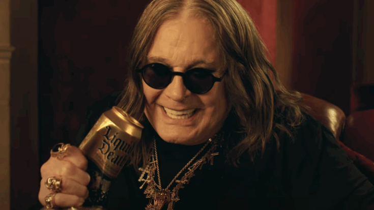 Ozzy Osbourne squeezing a liquid death can