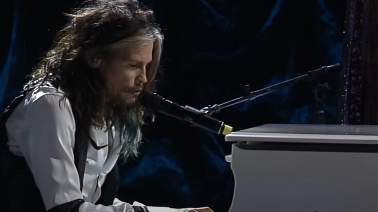 Steven Tyler playing his Yamahao grand piano in white
