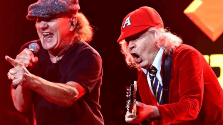 Brian Johnson and Angus Young of AC/DC delivering a high-energy rock performance during power tour