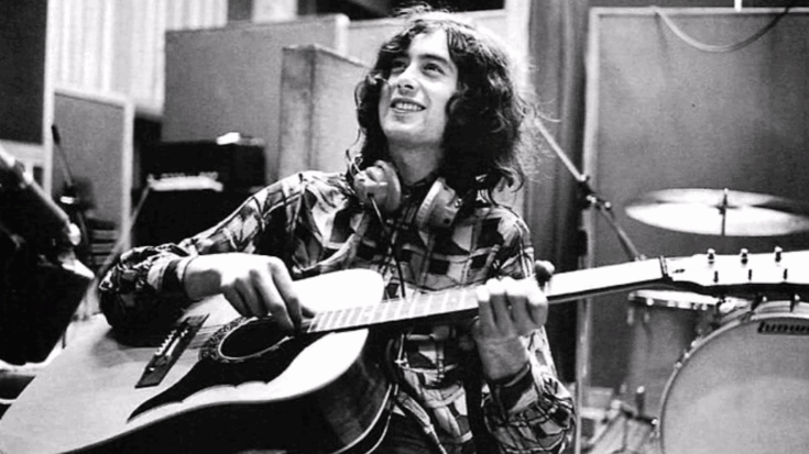 Jimmy Page playing acoustic guitar during a recording session in Led Zeppelin's early studio days