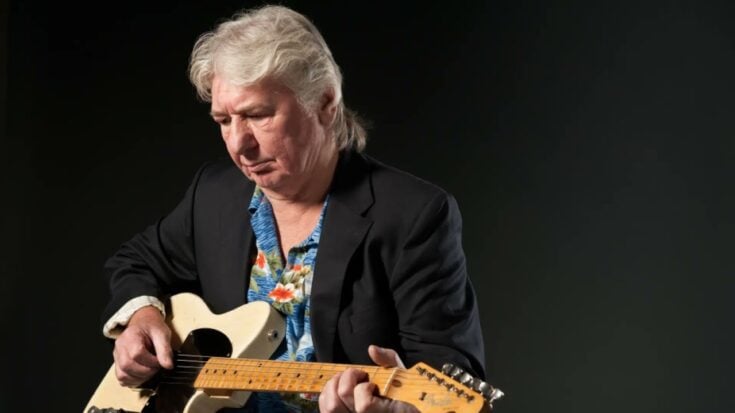 Mick ralphs holding a white telecaster