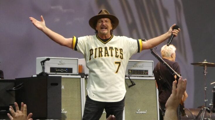 Eddie Vedder putting his arms up