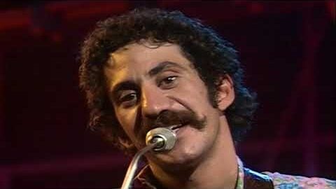 Jim Croce singing in a microphone