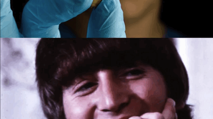 John Lennon smiling with a tooth on top
