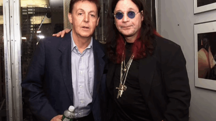 Paul McCartney standing next to Ozzy Osbourne, who is wearing round sunglasses and layered necklaces