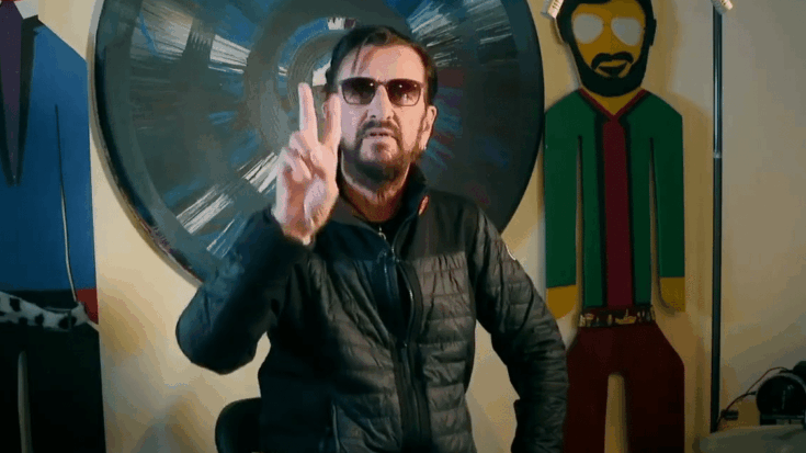 Ringo Starr putting up the peace sign