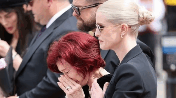 Sharon Osbourne covers her face in tears while Kelly Osbourne and Jack Osbourne stand by her side during Ozzy Osbourne’s funeral procession in Birmingham.