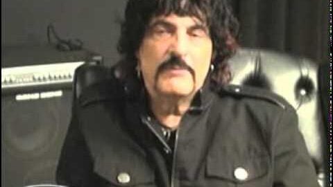 Vinny Appice in a past interview or promo appearance, seated in a studio with a drum gear logo visible in the corner.