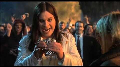 Ozzy osbourne wearing a white rtuxedo