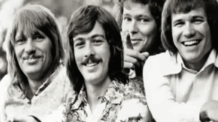 Members of the band Bread smiling together in a black and white group shot.