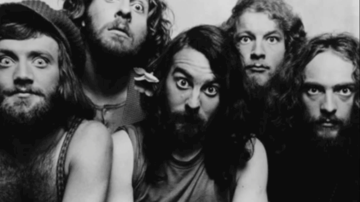 Jethro Tull band members posing together with intense expressions in a black and white setting.