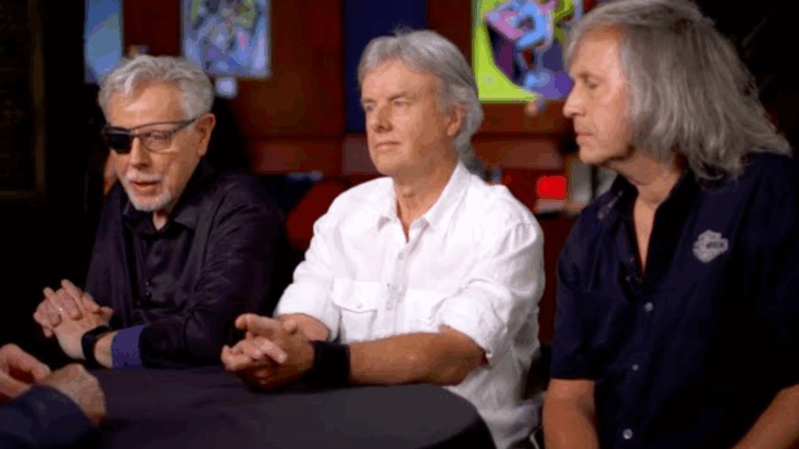 Members of Kansas sitting together at a round table during an interview.