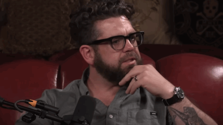 Jack Osbourne crying on a sofa