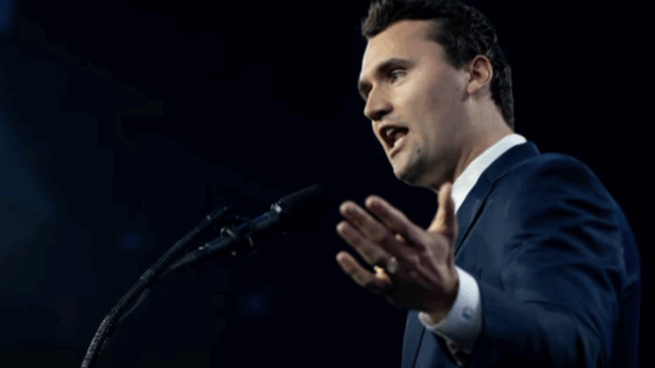 Charlie kirk wearing a suit speaking