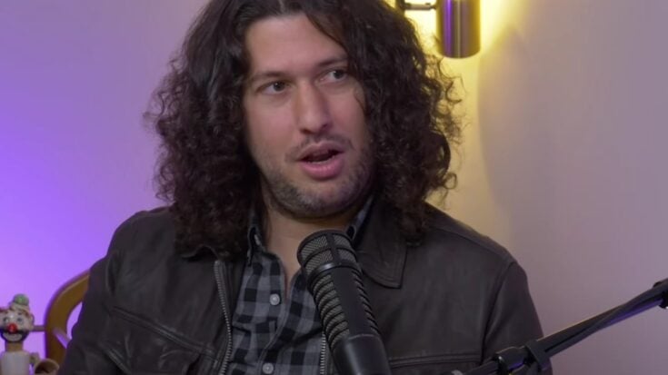 Ilan Rubin speakinbg on a mic in an interview