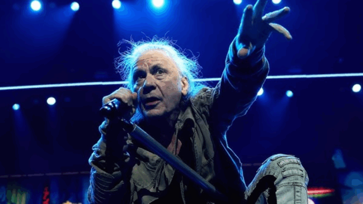 Bruce Dickinson of Iron Maiden reaching out to the crowd during the band’s massive live performance at London Stadium in 2025.