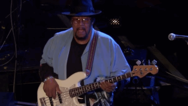 Billy Cox performing live on stage with his bass guitar, showcasing his signature groove and blues-rock style.