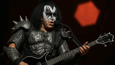 Gene simmons playing his black bass guitar