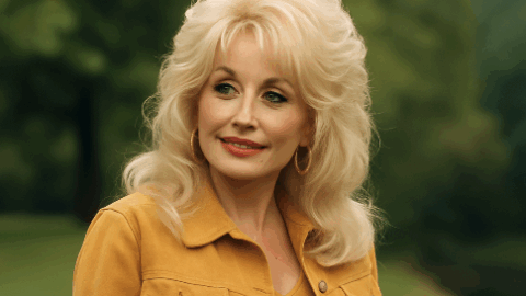 Dolly parton wearing a yellow jacket smiling in the distance