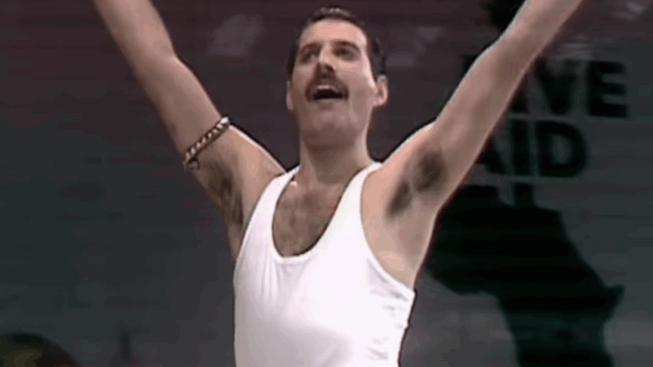 Freddie Mercury waving at fans.