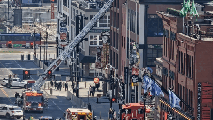 Picture of Kid rock's restaurant on fire with fire trucks around.