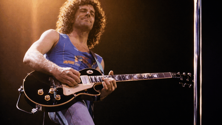 Neal Schon playing his iconic Les Paul guitar.