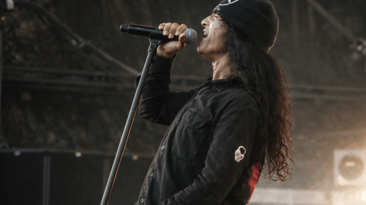 Anti-Social’s vocalist belts into the mic with raw intensity during a powerful live performance.