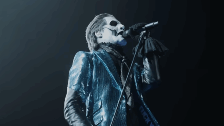 Ghost vocalist singing in full costume.