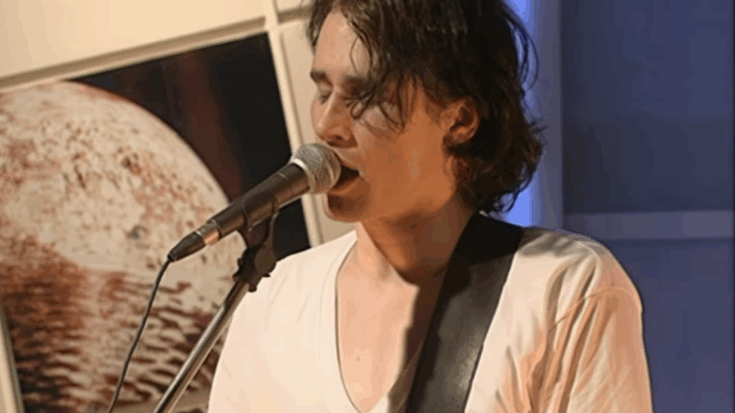 Jeff Buckley wearing a white shirt singing