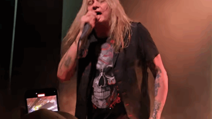Sebastian Bach singing on stage.