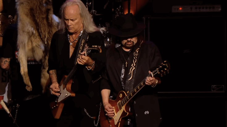 Lynyrd Skynyrd playing together on stage.