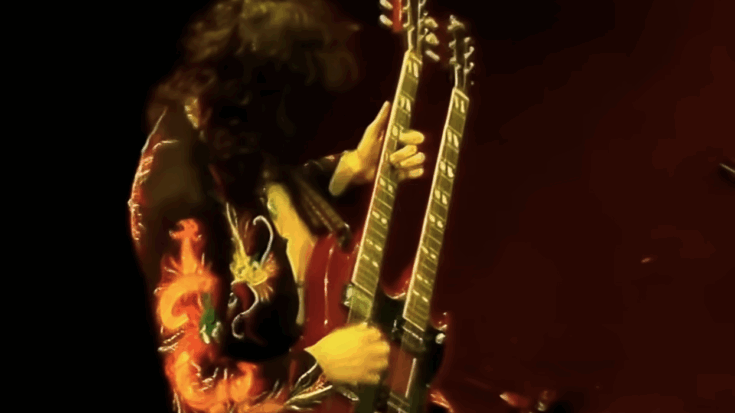 Jimmy Page playing his double neck guitar.